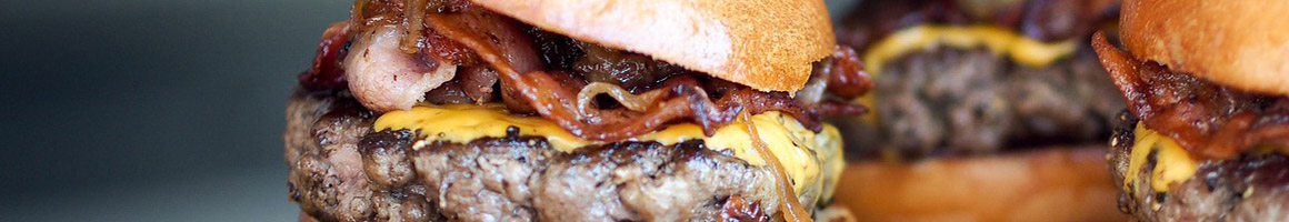 Eating American (Traditional) Burger at Jucys Hamburgers restaurant in Tyler, TX.